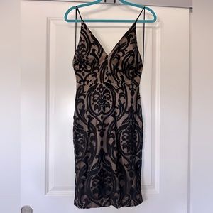 Bodycon spaghetti strap black dress with pattered sheer overlay